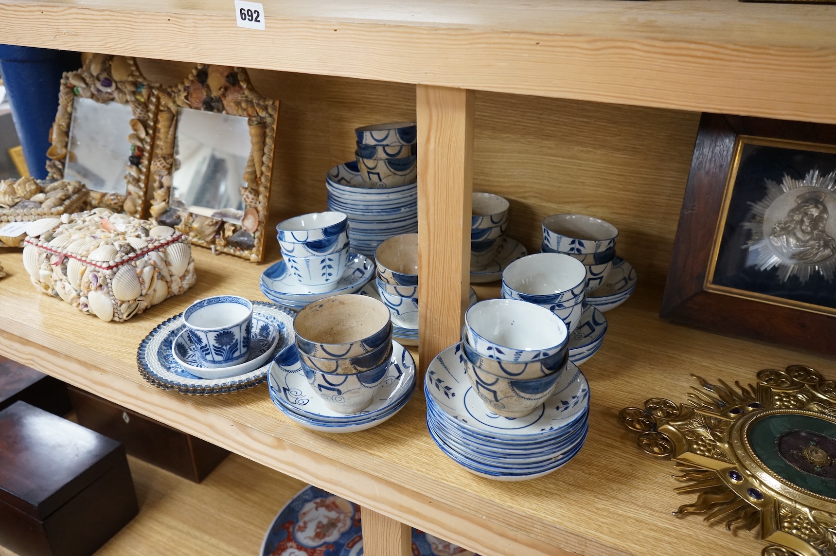 A group of 19th century pearlware set of tea bowls and saucers and to similar basket with border plates